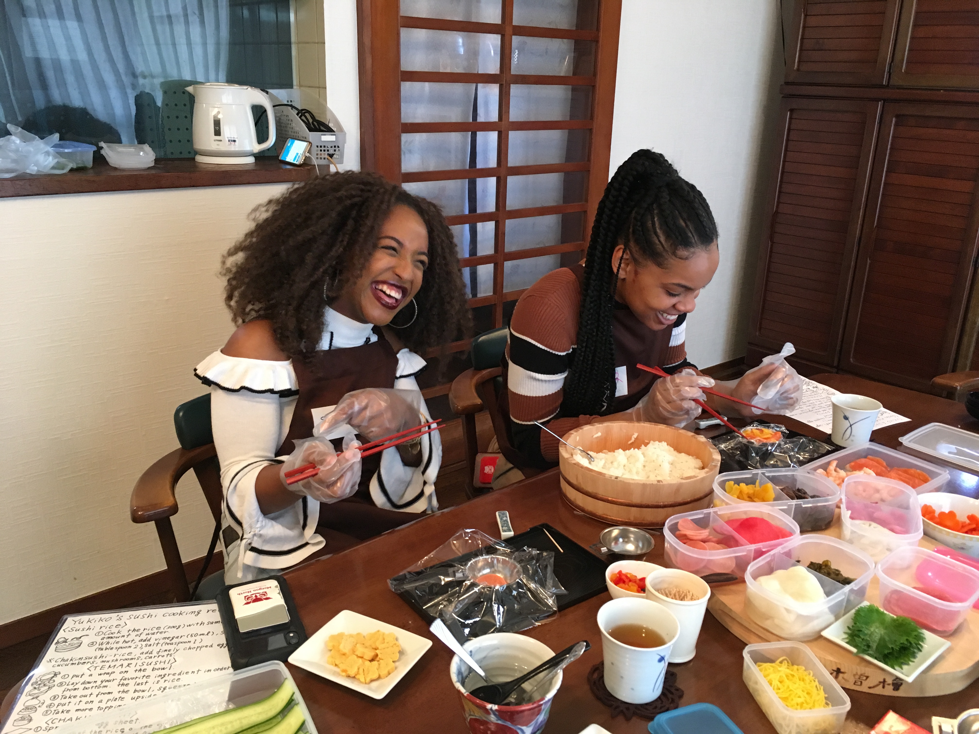 Laughter fills the room as participants create sushi masterpieces surrounded by fresh ingredients and the warmth of a local home deepening the cultural experience of Japanese culinary tradition.