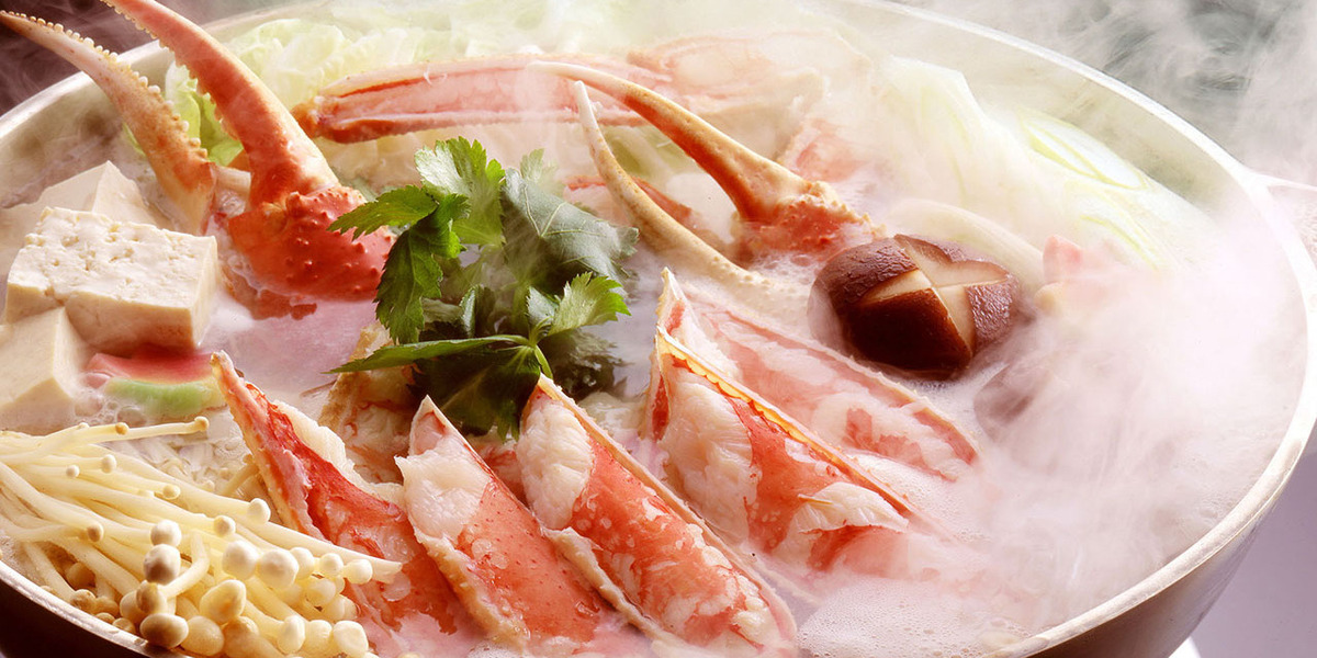 Indulge in a steaming pot of Hokkaido's finest crab dishes where fresh ingredients meet tradition creating a delightful dining experience in the heart of Susukino.