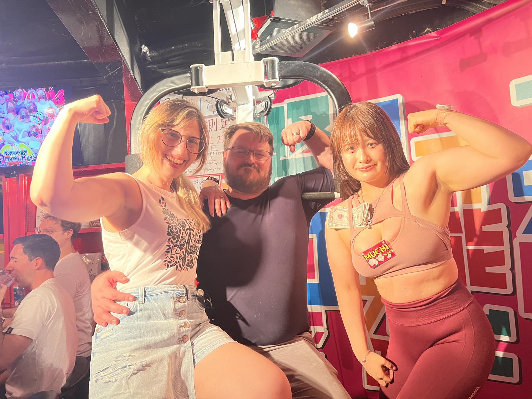 Experience a unique blend of strength and fun as you break objects and bond with powerful muscle girls enjoying a mix of drinks that fuels both body and spirit.