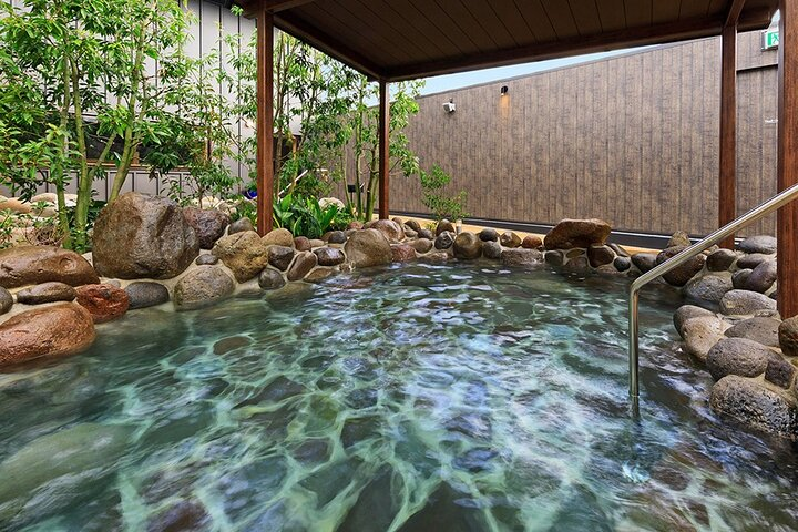 Experience serene relaxation at Fukuoka's largest hot springs rejuvenating mind and body while surrounded by natural beauty and soothing waters perfect for unwinding after a day of adventures.