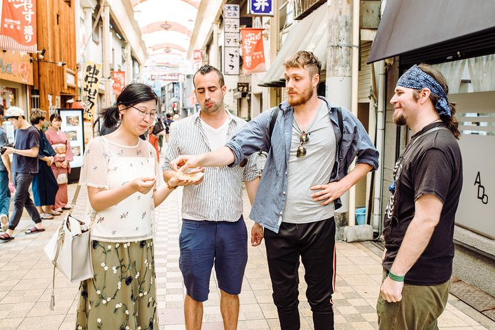 Wander through Nakazakicho's charming streets where unique cafes and vintage shops await. Engage with locals and savor unexpected delights in this artistic haven of Osaka.