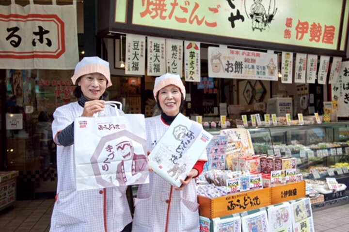 Experience the charm of Kameari as you stroll past local shops savoring delicious snacks while your Shiba Inu companion enhances your adventure through this historic Tokyo neighborhood.