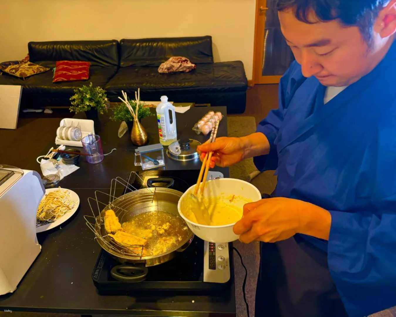 Experience the art of tempura in Osaka mastering the techniques of frying shrimp and vegetables while savoring a delicious meal of rice miso soup and green tea. Perfect for families!