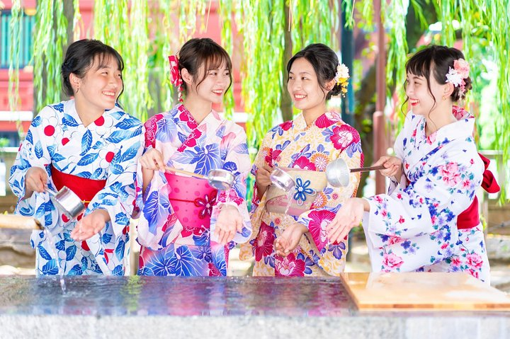 Dressing in elegant kimonos adds to the charm of Asakusa where friends enjoy traditional rituals and scenic backdrops creating unforgettable memories in the heart of old-town Tokyo.