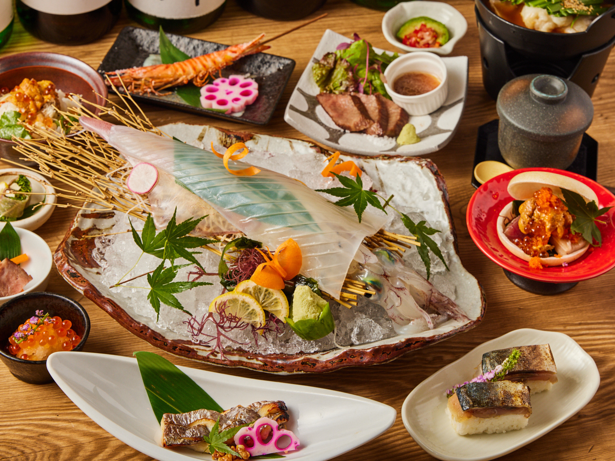 Delight in the artistry of Hakata Kaisen Watatsumi's live squid sashimi and succulent Saga beef steaks showcasing the best of Kyushu's culinary treasures in an inviting setting.
