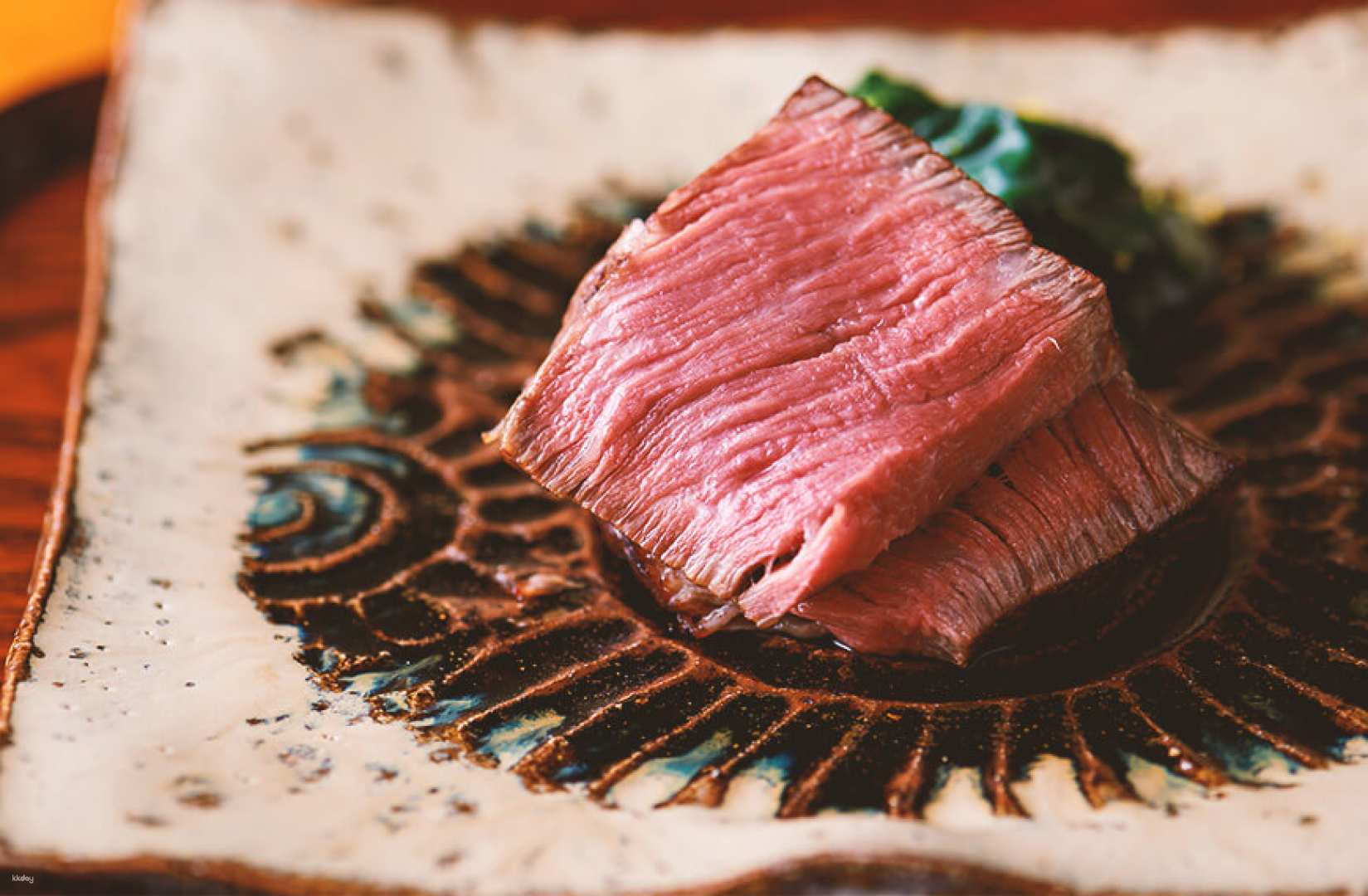 Savor the exquisite flavors of Oniku Karyu's premium Wagyu beef artfully presented to engage your senses and create unforgettable dining moments in a unique culinary experience.