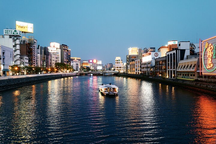 Experience the unique blend of modernity and tradition as you glide along Fukuoka's waterways where illuminated cityscapes meet serene reflections revealing hidden gems of Japanese culture.