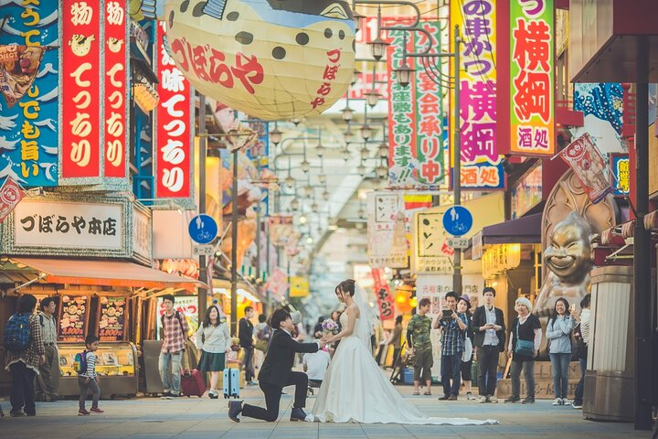 Capture unforgettable moments in Osaka's lively streets where love stories come to life amid stunning sights. An experience filled with beauty laughter and lasting memories awaits.