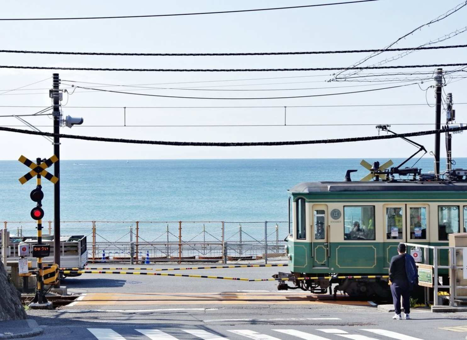 Experience the charm of Kamakura as the Enoden tram makes its way along the scenic coastline merging history and modern travel in a delightful exploration of Japan’s beauty.