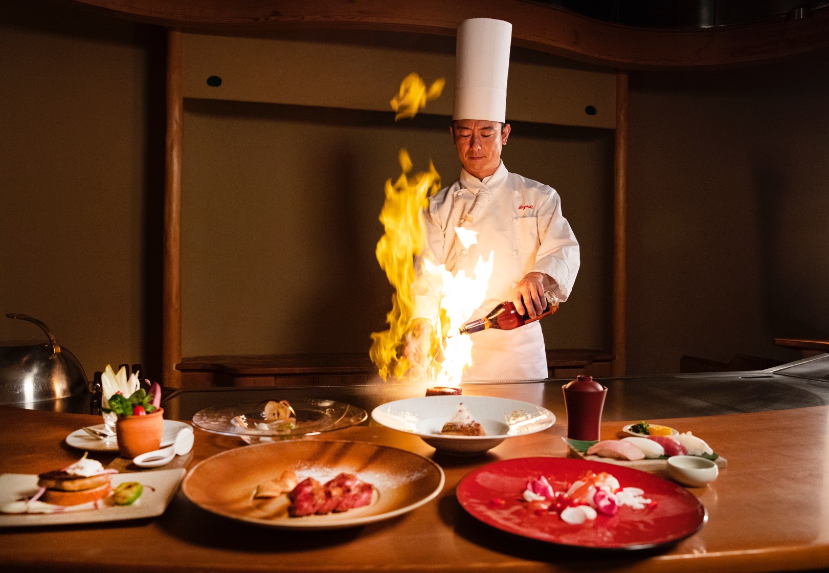 Savor an unforgettable Teppanyaki experience at Japanese Cuisine Sakura where skilled chefs ignite culinary artistry against the backdrop of a serene Japanese garden. Delight in seasonal flavors expertly prepared.