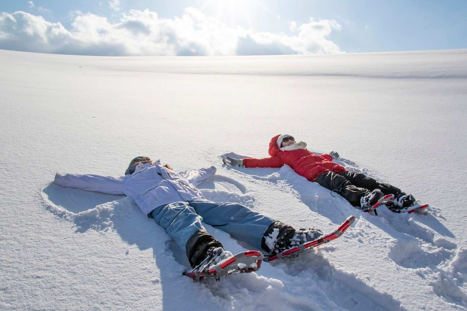 Immerse yourself in the serene snowfields of Biei where laughter fills the air as everyone from kids to adults enjoys the magic of winter while making snow angels.