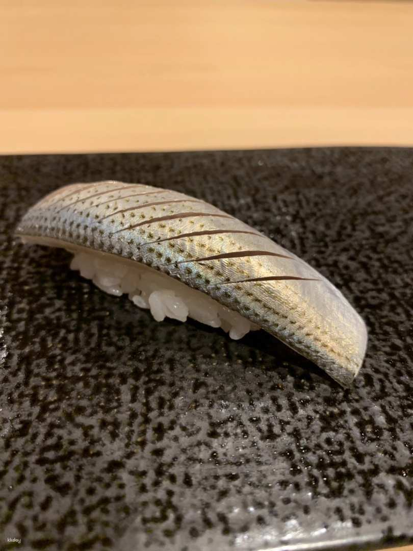 Savor authentic Edomae sushi meticulously crafted with seasonal ingredients and the finest seafood showcasing Michelin-star quality in an intimate dining setting that highlights culinary mastery.