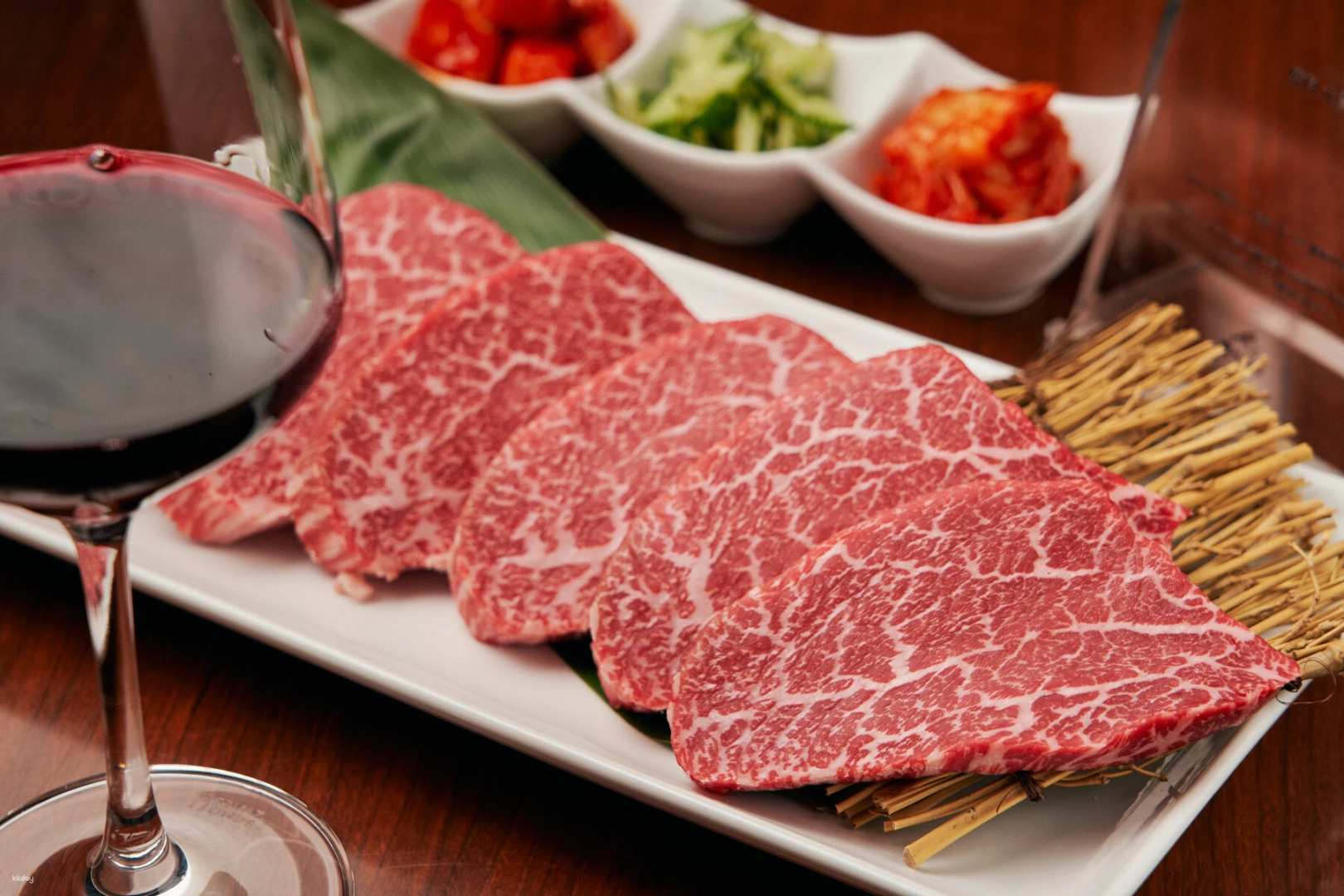 Experience the rich flavors of Tare Yakiniku at Yakiniku Onuki where expertly grilled beef tongue and fine selections pair perfectly with wine immersing travelers in Japan's culinary heritage.