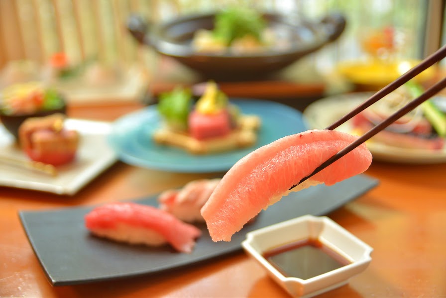 Savor the essence of Tokyo with exquisite Sendai Beef Tenpura and sushi showcasing culinary artistry amidst inviting setting and fresh ingredients for an unforgettable dining experience.