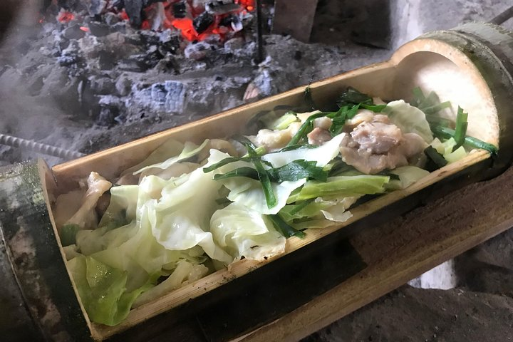 Experience the joy of Kappa chicken cooking utilizing green bamboo as a unique vessel while savoring the flavors of local ingredients in a delightful culinary journey in Kyushu.