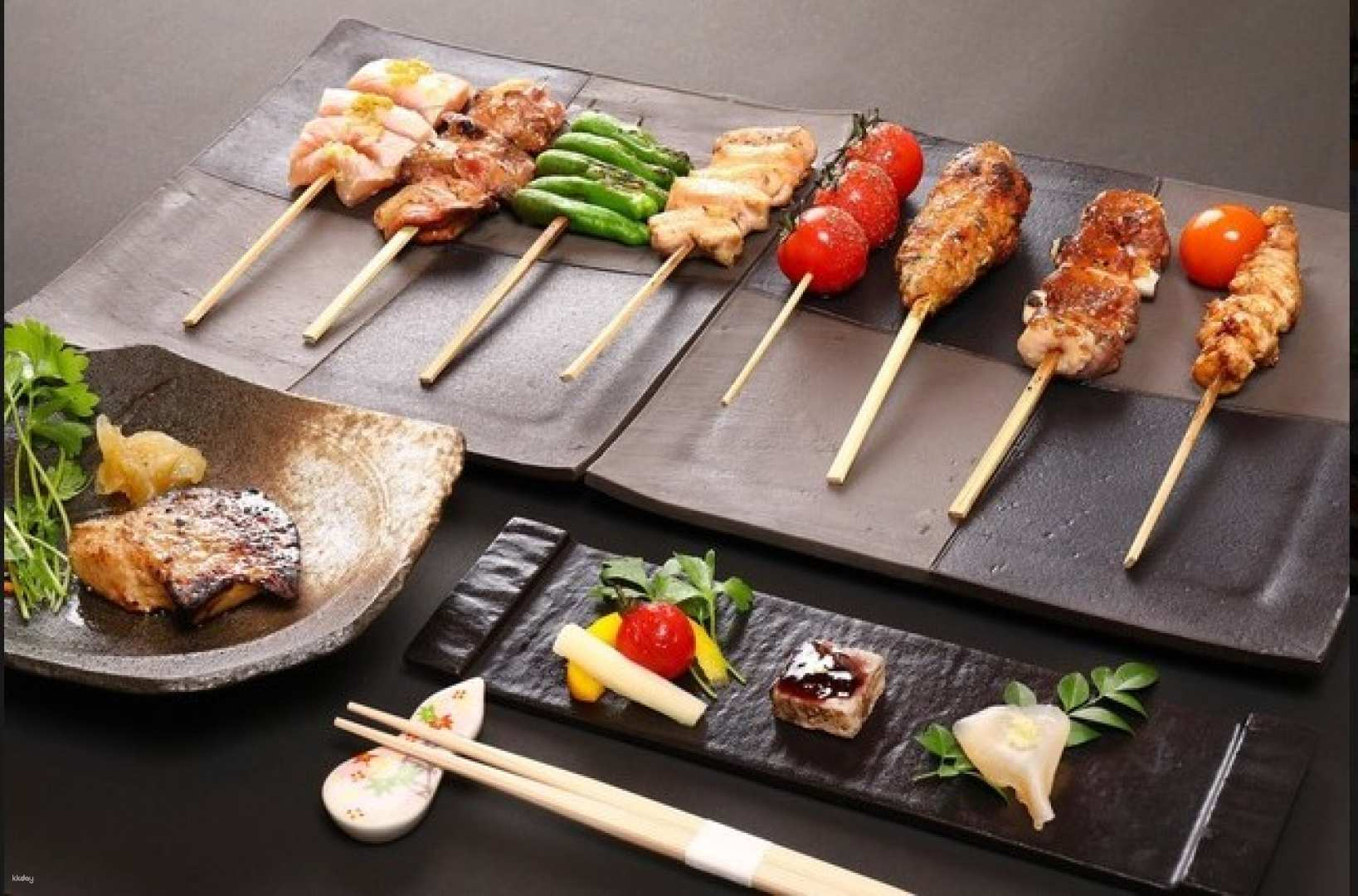 Experience the essence of Japanese cuisine with expertly grilled local chicken perfectly complemented by fresh ingredients and traditional presentation all in a serene dining setting.