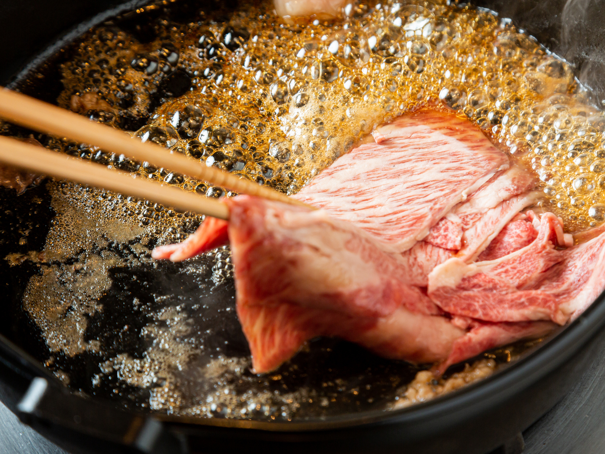 Indulge in the rich flavors of Matsusaka beef sukiyaki expertly cooked to perfection. Enjoy a unique culinary experience just minutes from Namba Station complemented by an array of drinks.
