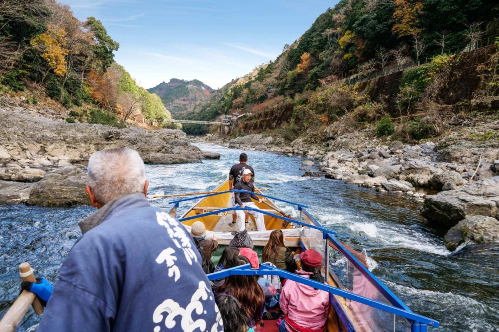 Kameoka Station departure point for Hozu River boat rides showing the train platform and scenic mountain backdrop where the river journey begins