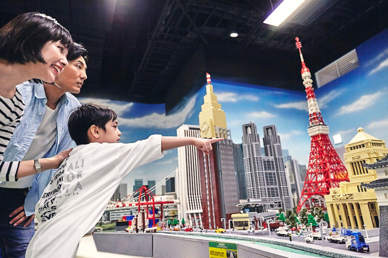 Explore a miniature wonderland where iconic Tokyo landmarks come alive in LEGO form sparking imagination and joy for families as they interact with creative displays and detailed cityscapes.
