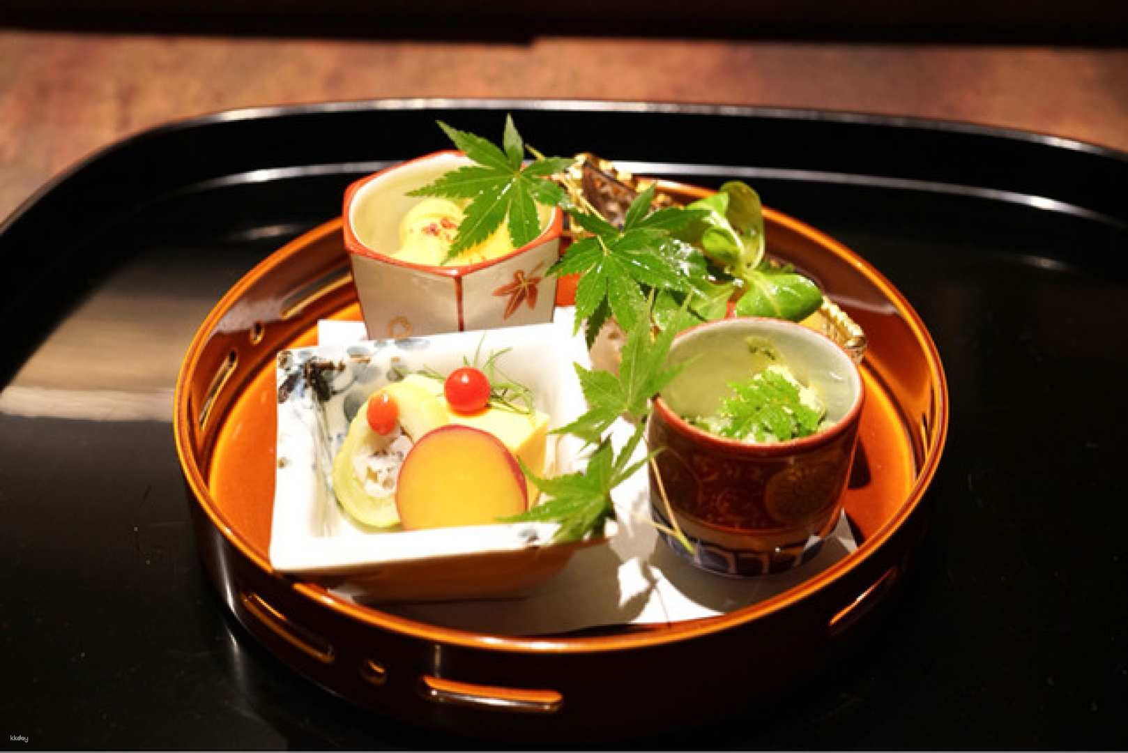 Delight in exquisite Japanese dishes artfully presented showcasing seasonal ingredients. Experience a serene dining experience perfectly complemented by carefully selected sake in a historic setting near Osaka's lively center.