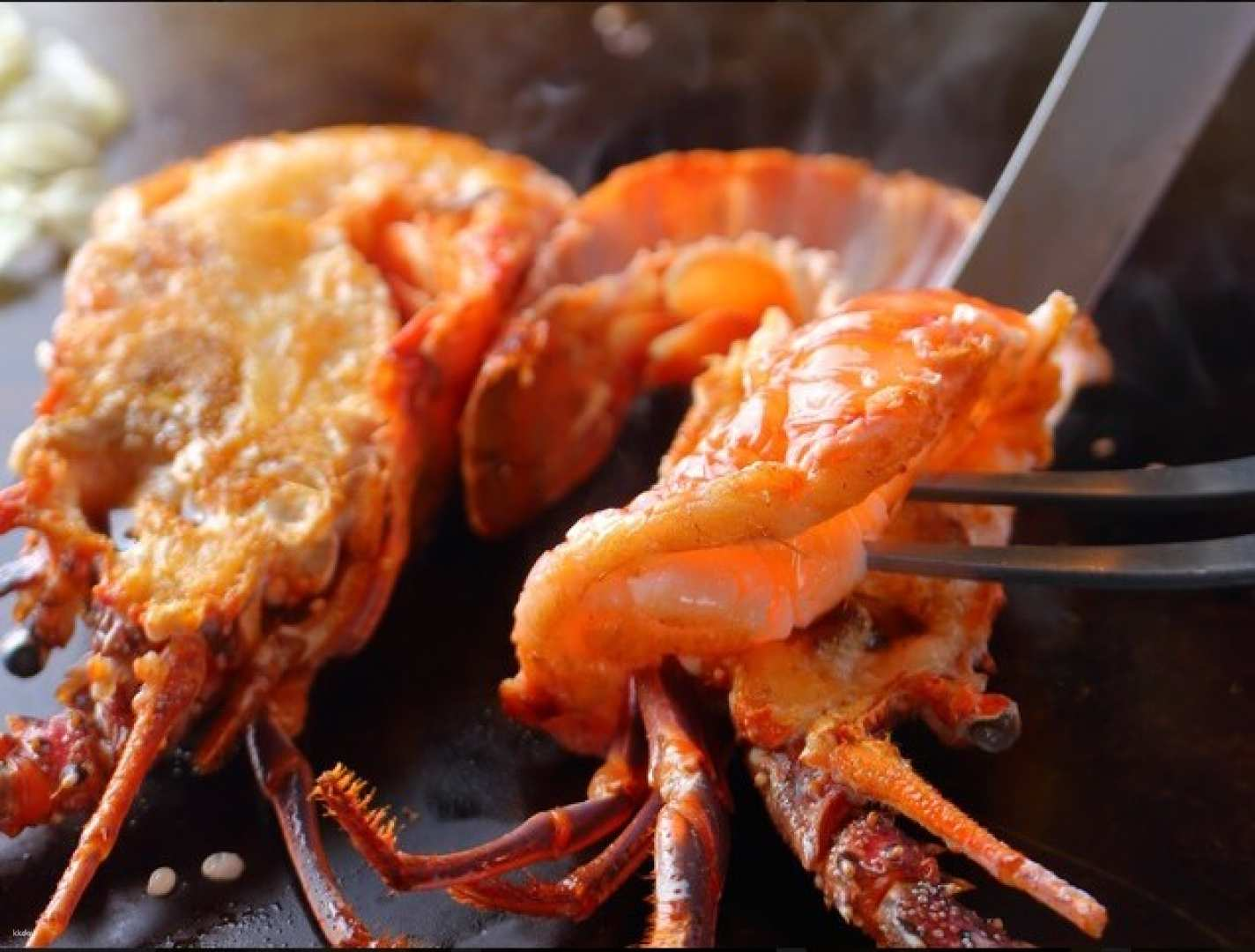 Savor the exquisite taste of A5 Kuroge Wagyu and freshly grilled lobster at Michelin-recommended Teppanyaki Sakura where culinary craftsmanship meets a tranquil dining experience in the heart of Tokyo.