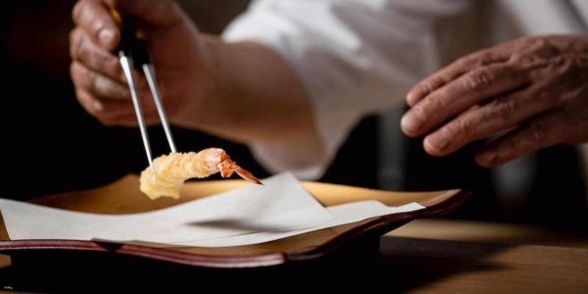 Savor the delicate artistry of tempura as it’s meticulously crafted by skilled chefs showcasing Japan's culinary excellence in a refined setting perfect for gastronomic exploration.