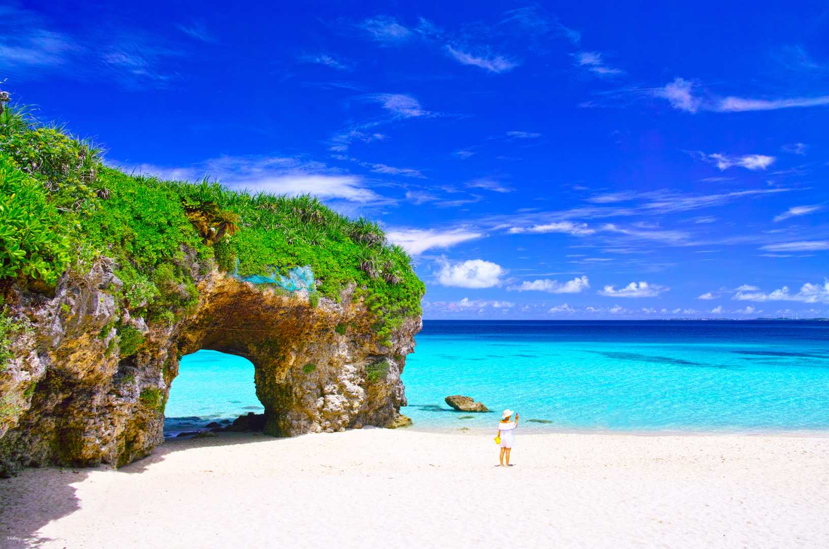 Experience the beauty of Sunayama Beach where soft white sands meet clear blue waters and striking rock formations invite exploration. A perfect spot for relaxation and stunning photos.
