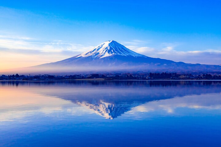 Experience the serene beauty of Mt. Fuji mirrored in tranquil waters complemented by a visit to Hakone's soothing hot springs perfect for unwinding amidst nature's wonders.