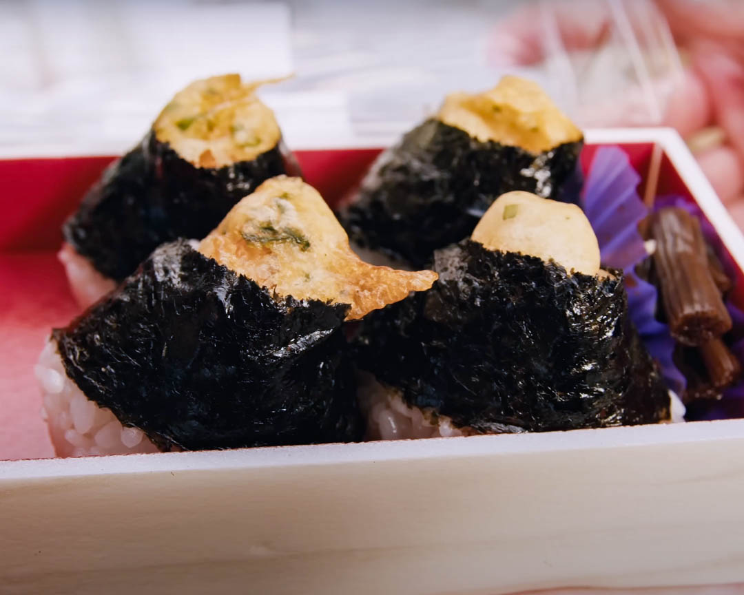 Explore the unique flavors of Nagoya with grilled rice cakes and fried chicken immersing yourself in Japan's culinary culture amidst historic streets and local traditions.