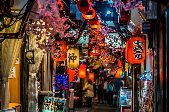 Wander through picturesque alleyways adorned with glowing lanterns and cherry blossoms where you can immerse yourself in Japanese culture while enjoying unique puppet shows and crafting your own beckoning cat.