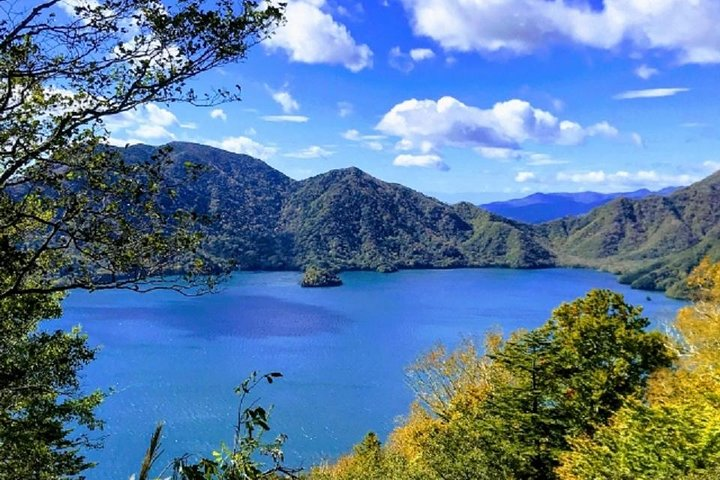 Experience the beauty of Chuzenji Lake surrounded by majestic mountains and clear skies. A perfect spot for tranquility and breathtaking views during your private tour in Nikko.