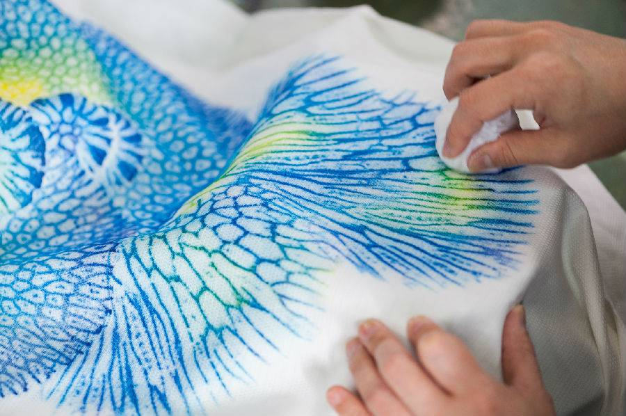 Experience the intricate art of coral dyeing at Shuri Ryuzen where traditional techniques blend with the natural beauty of Okinawa creating stunning pieces that celebrate the region's rich heritage.