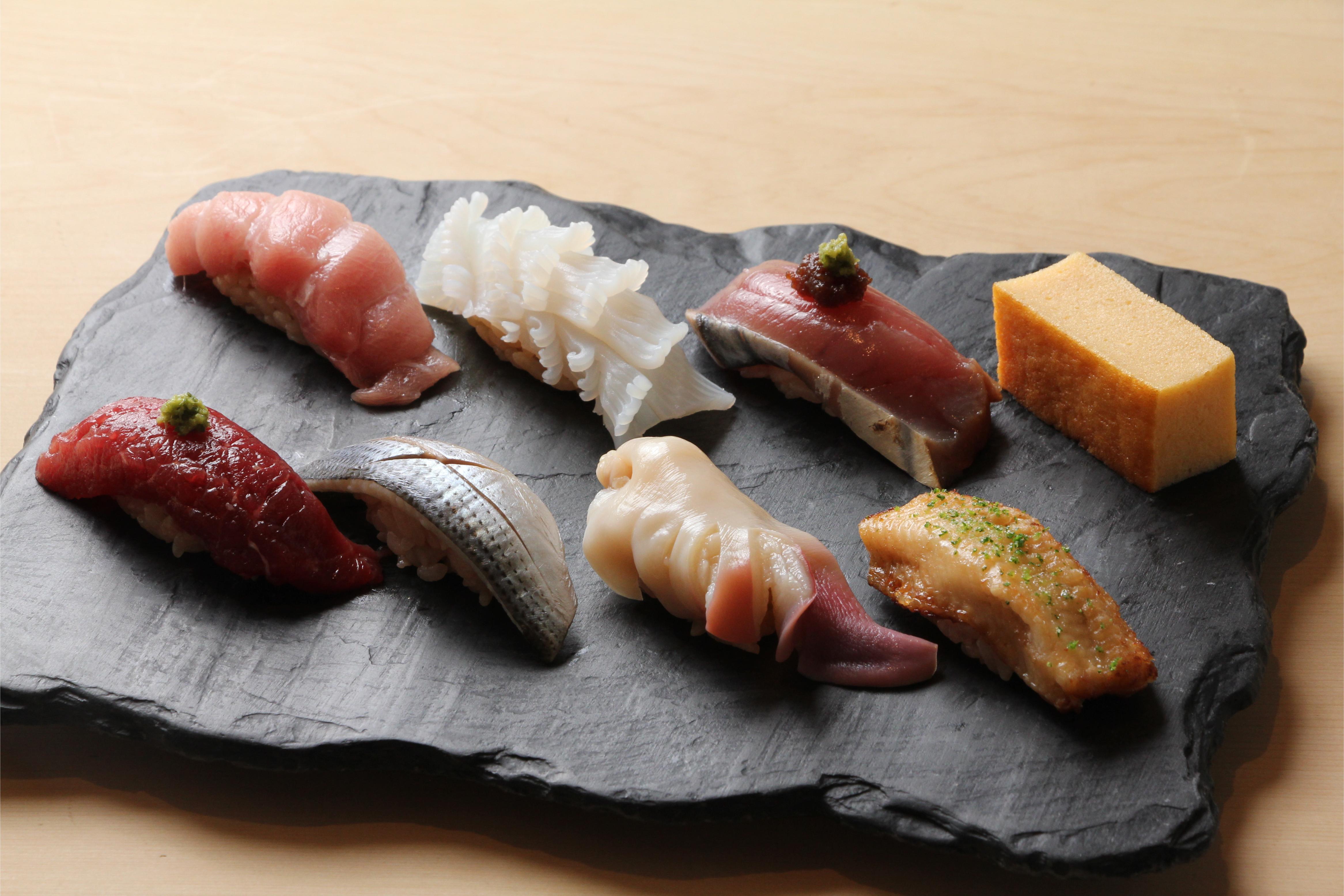 Experience the art of Edo-mae sushi at Ginza Sushi Masa where expert chefs craft each piece with precision in a serene elegantly designed setting complemented by exquisite sake and wine selections.