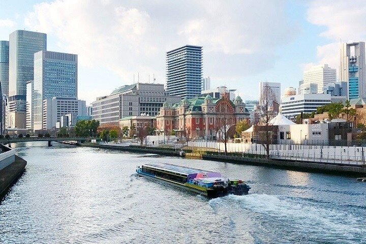 Explore Osaka's unique blend of modern skyscrapers and historic architecture from a relaxing riverboat cruise showcasing the charm of Japan's bustling heart. Discover the city's hidden gems along the way.