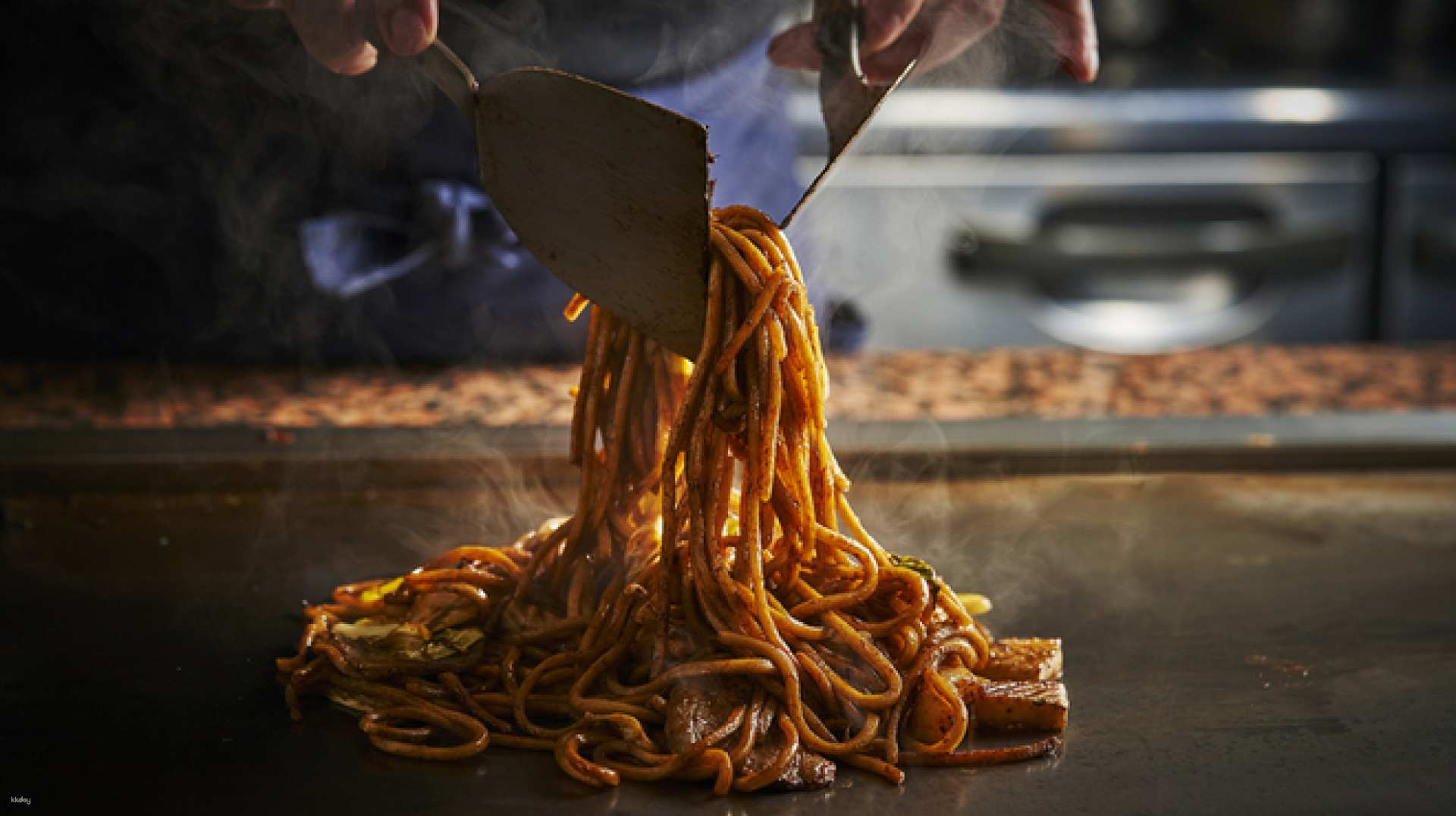 Experience the art of Teppanyaki as skilled chefs prepare delicious Okonomiyaki right before your eyes showcasing over 78 years of culinary tradition in the heart of Osaka.