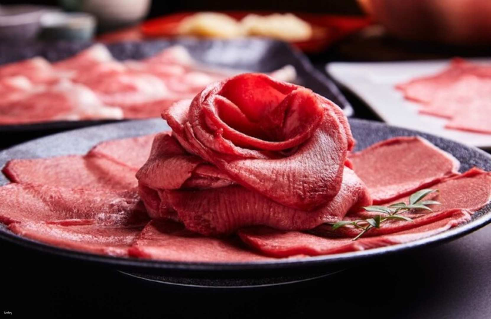 Savor the exquisite Kuroge Wagyu beef at Kitashinchi Shabu Shabu Kiraku where unique cooking techniques meet traditional Japanese decor for an unforgettable dining experience in Osaka.