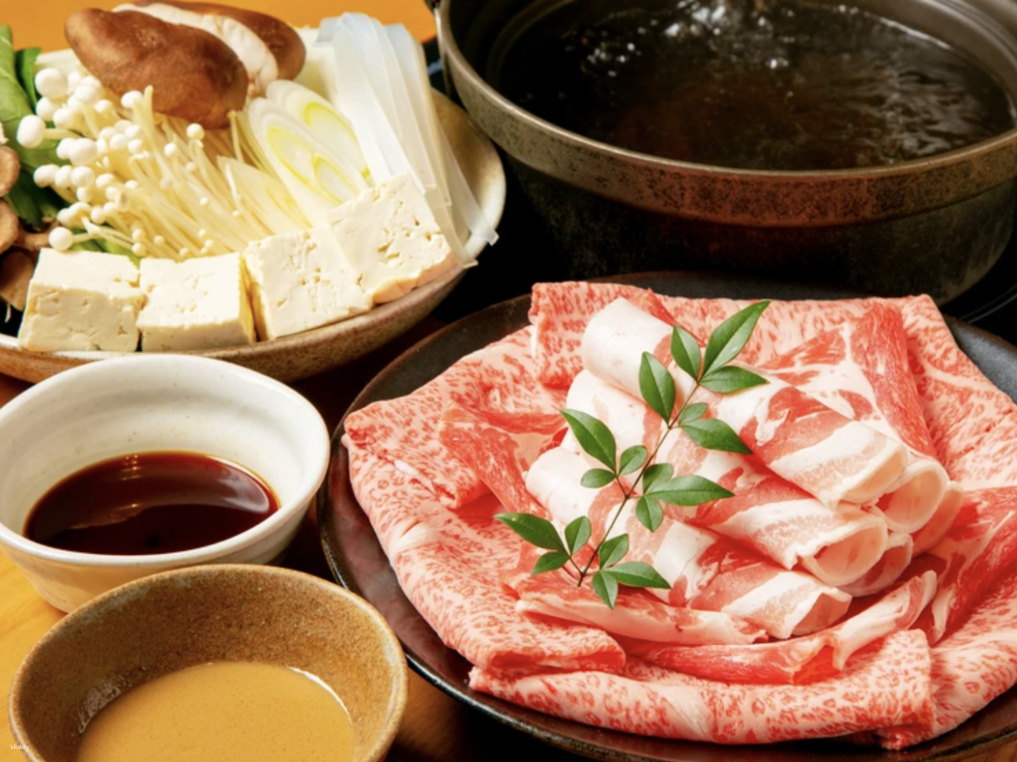 Experience the exquisite taste of Kagoshima Black Beef in an elegant Japanese-style setting perfect for savoring shabu-shabu and sukiyaki with loved ones. A true culinary delight awaits.