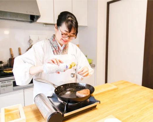 Experience the art of Japanese cooking with Yoko-sensei as you learn to create delicious ramen and gyoza in a cozy kitchen setting immersing yourself in authentic culinary traditions.