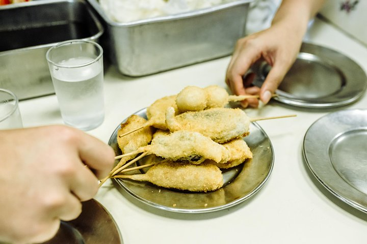 Savor the unique flavors of Osaka's hidden Ura Namba as you explore local izakayas and dive into delicious street food guided by a knowledgeable host who shares culinary secrets.