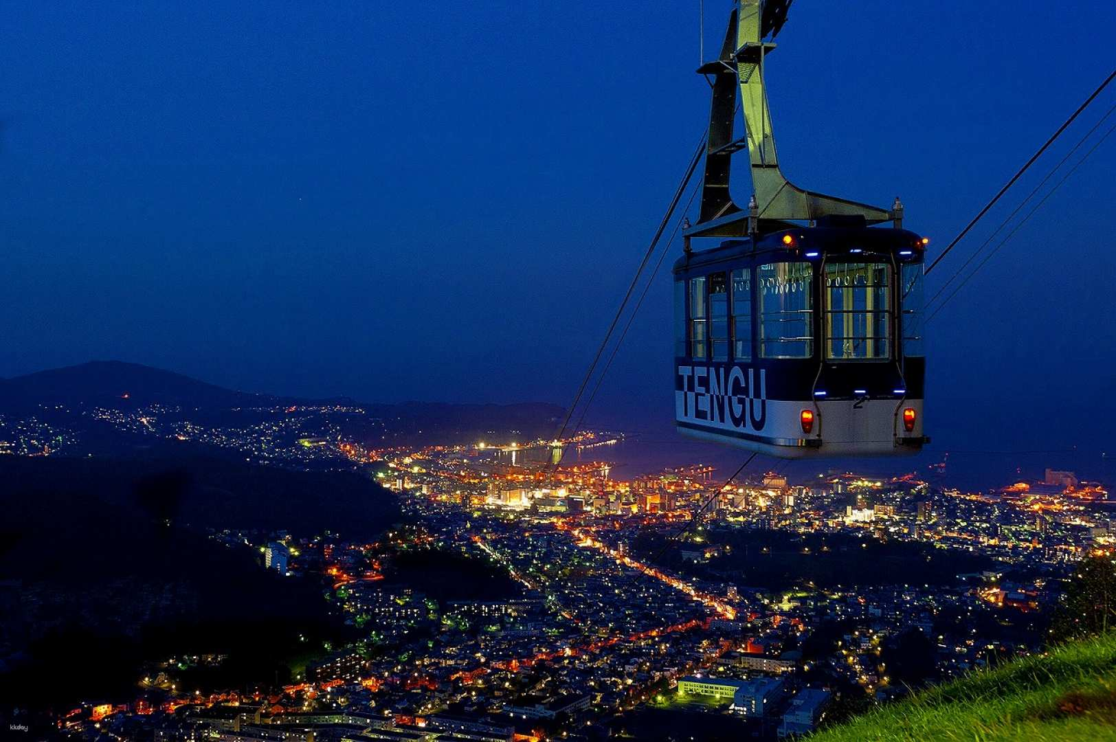 Experience the stunning views from Otaru Tenguyama Ropeway as you ascend under the night sky revealing the sparkling lights of the city below and nearby attractions waiting to be explored.
