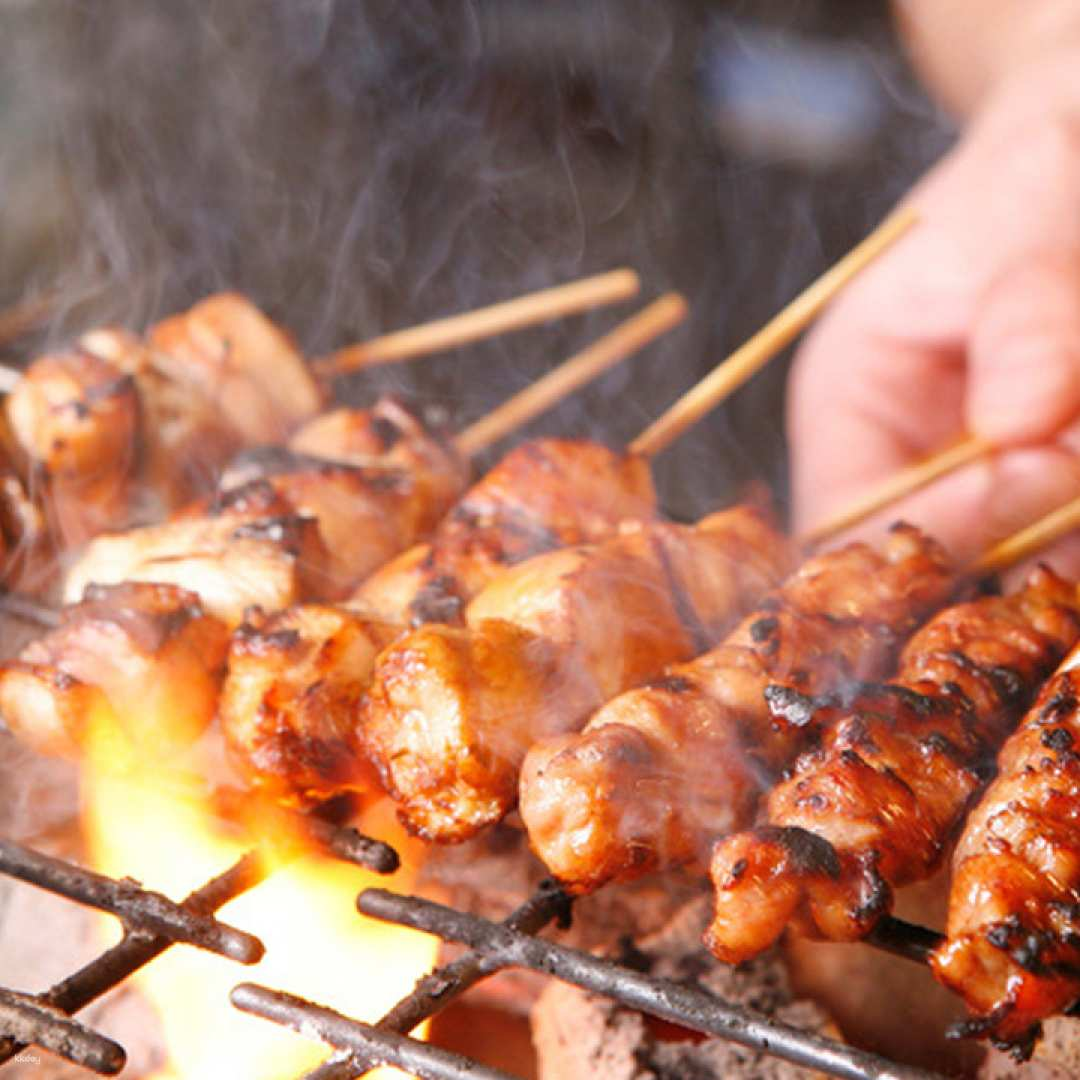 Savor the smoky aroma of grilled yakitori at Koshitsuizakaya Jidoribozu where friendly dining meets delicious Japanese chicken specialties just steps from Ueno Station. Perfect for memorable gatherings!