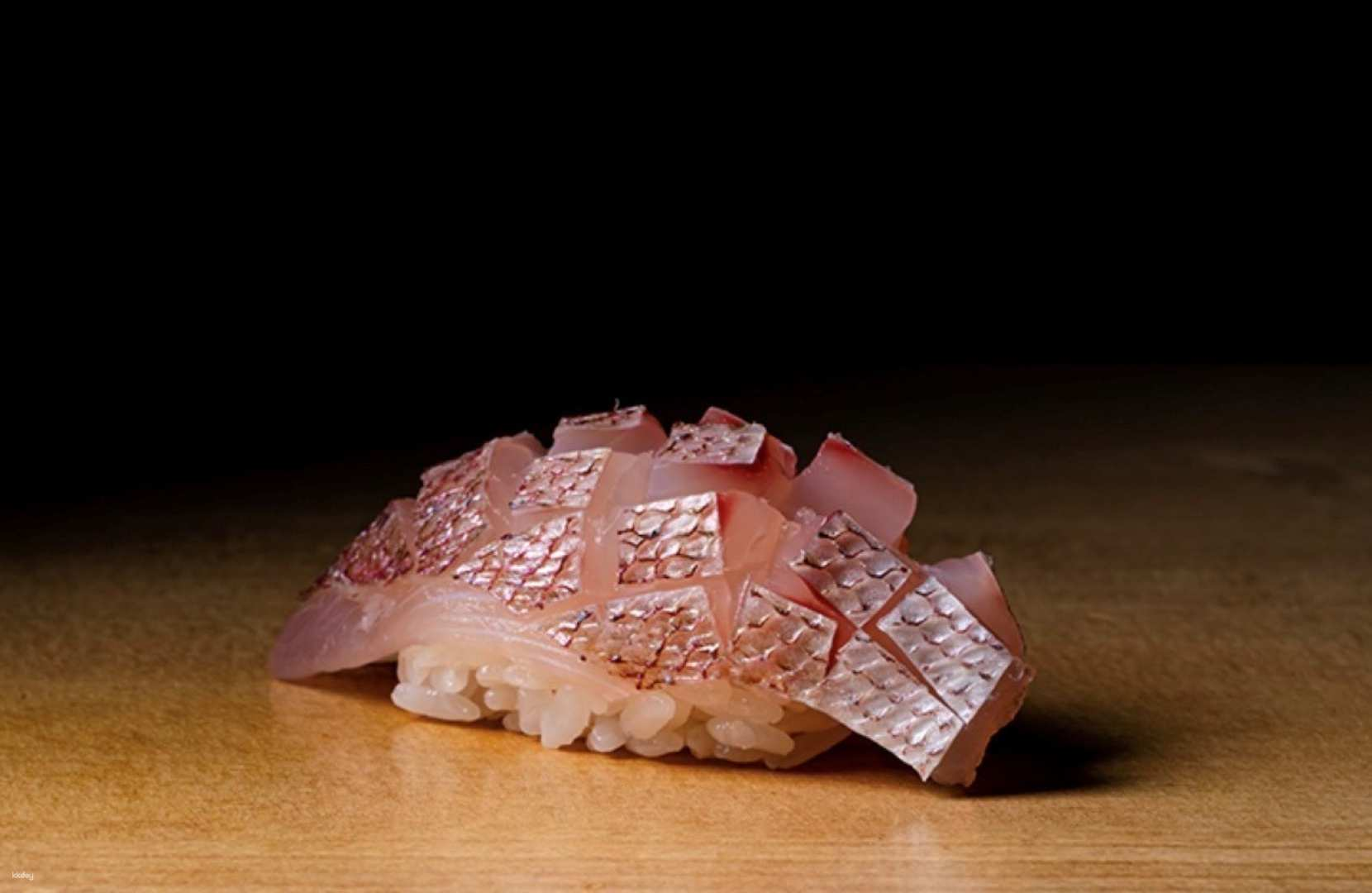 Experience the artistry of Edomae sushi at Sushi Risaki where meticulously sourced ingredients create a culinary journey paired expertly with a selection of fine Japanese sake in Tokyo's charming Ebisu district.