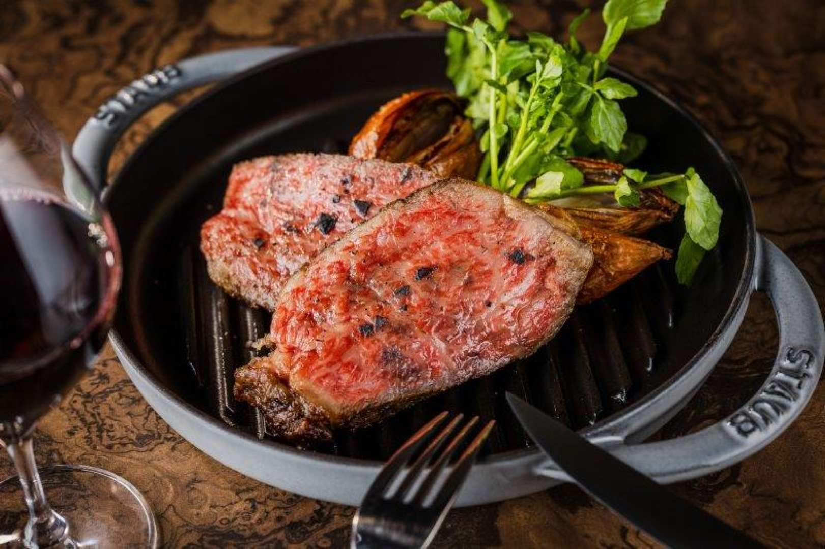 Experience the allure of perfectly grilled Wagyu steak enhanced by elegant surroundings and a fine glass of wine making every meal a luxurious escape in Tokyo's Kabukicho Tower.