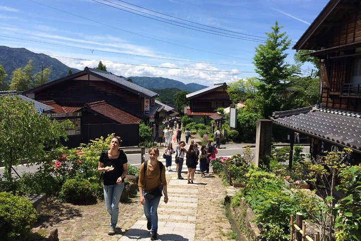 Experience history while strolling the scenic trails between Magome and Tsumago surrounded by traditional architecture and picturesque landscapes all echoing the charm of ancient Japan.