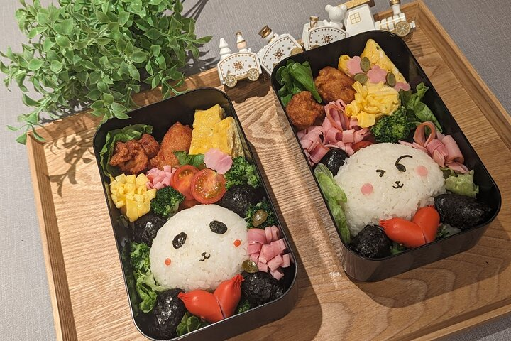 Experience the joy of creating adorable character bentos like playful pandas while embracing Japanese culinary traditions in a lively hands-on workshop setting perfect for all skill levels.