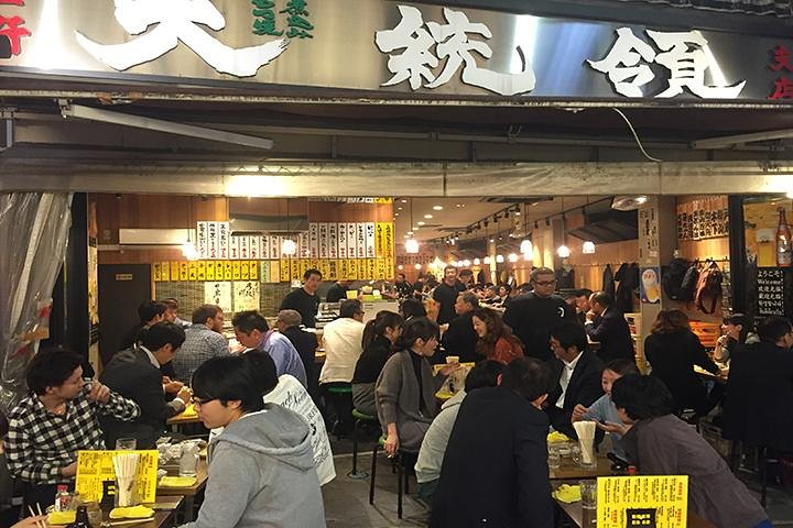 Immerse yourself in the lively scene of Tokyo's izakayas where locals gather over small plates and drinks creating unforgettable connections and experiences in hidden culinary gems.