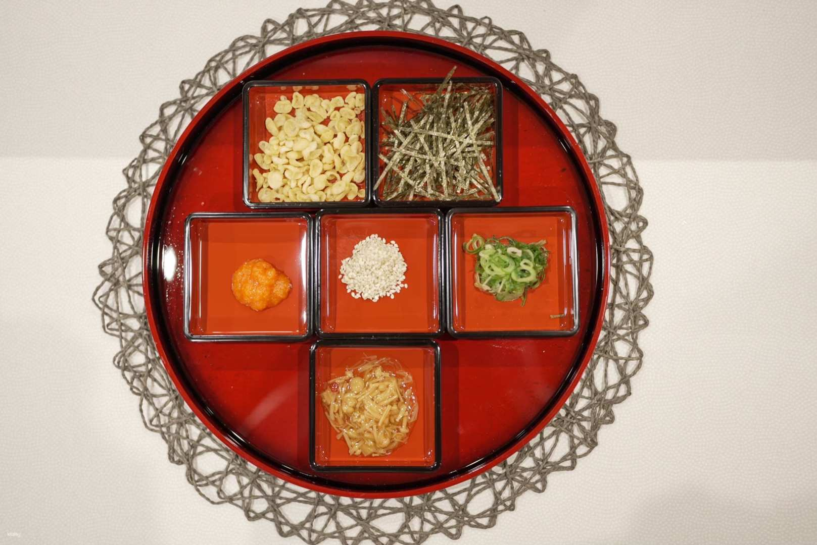 Experience the unique charm of Wanko Soba at Kuru Kuru Wanko where each bite is paired with a delightful array of traditional toppings perfect for food lovers and families alike.