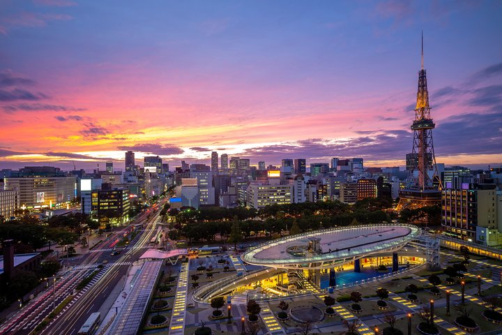 Experience the romance of Nagoya as the sky transforms at dusk illuminating iconic landmarks and inviting couples to explore its charming nooks perfect for unforgettable memories and stories.