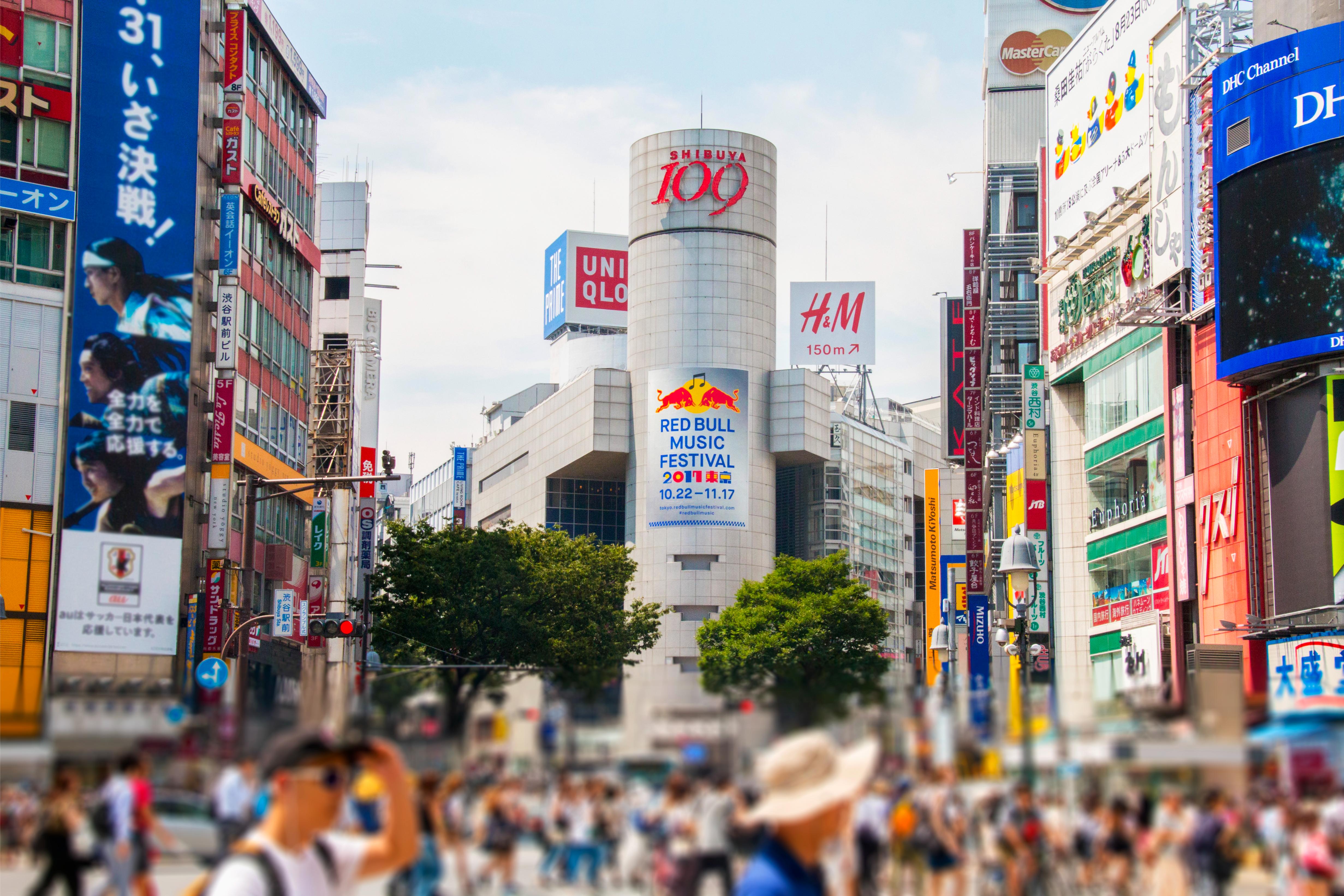 Experience the bustling essence of Shibuya with its iconic Scramble Crossing surrounded by dazzling shops and lively crowds before diving into the art of creating beautiful temari sushi.