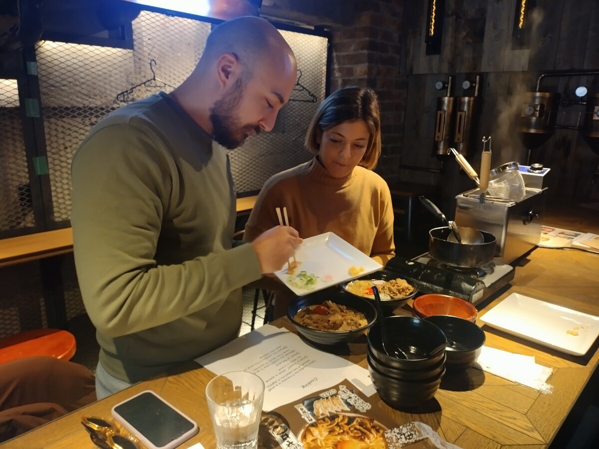 Experience the art of ramen-making in a retro-modern setting where culinary creativity meets the joy of crafting delicious dishes perfectly paired with signature craft beer.